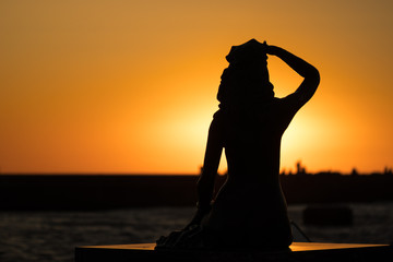 Silhouette of the Mermaid Monument in Ustka.