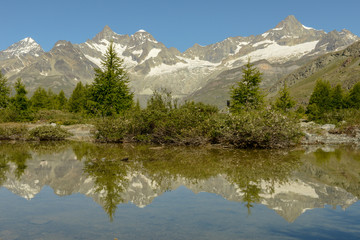 Naklejka na ściany i meble Mountain landscape with a lake over Zermatt in the Swiss alps