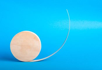 wooden boxe standing on a side edge on a light blue background