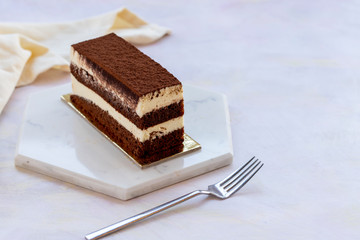 tiramisu cake on white wood