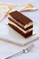 tiramisu cake on white wood