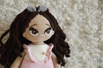 handmade doll. decorative toy. beautiful knitted toy for children. girl. home comfort.