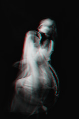 portrait of a Ghost girl in a dress with blurred on a dark background