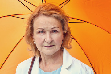 Caucasian elderly businesswoman outdoor.