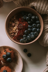 Breakfast with granola, eggs, coffee and cakes