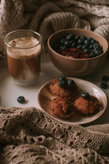 Breakfast with granola, eggs, coffee and cakes