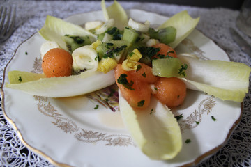 exquisite salad of endives, kiwi and melon