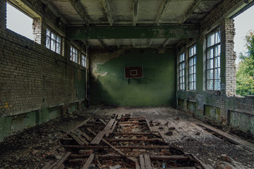 Fototapeta na wymiar Ruined gymnasium in abandoned school
