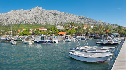 Fototapeta na wymiar Orebic - The panoramic view the harbor, town and Sveti Ilija Mountain on the Peliesac penicula - Coratia