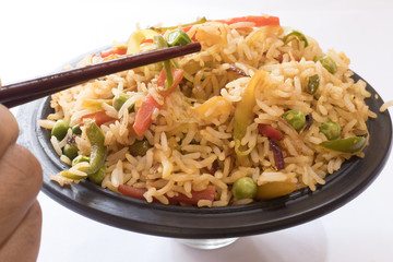 Chinese fried rice with vegetable. Prepared and served in a bowl 