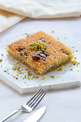 sherbet kadayif dessert on white wood