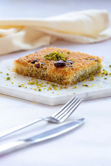 sherbet kadayif dessert on white wood