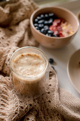 Breakfast with granola, coffee and cakes