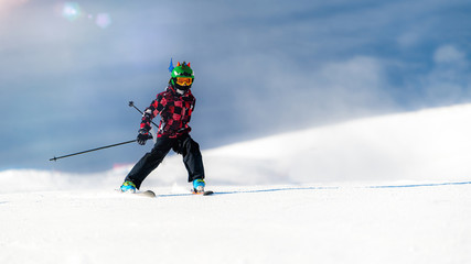Fototapeta na wymiar Portrait of boy skier on the mountain
