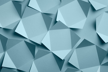 Obraz premium Light blue paper folded in geometric shapes. Abstract composition