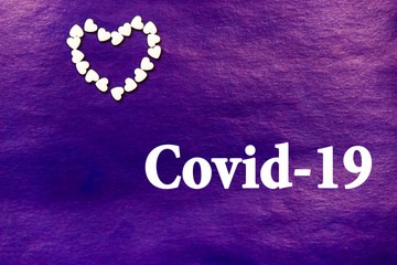 white tablets on purple background. top view