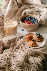 Breakfast with granola, coffee and cakes