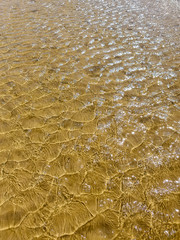 sea water texture on beach overhead view