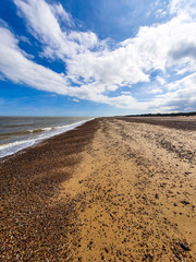 empty british seaside beach on sunny day