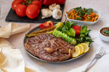 Isolated grilled beef steak on a wooden board