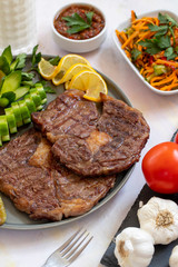 Isolated grilled beef steak on a wooden board