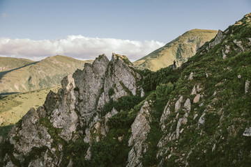 A group of people on a rocky hill