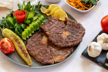 Isolated grilled beef steak on a wooden board