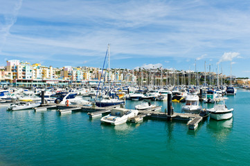 Fototapeta na wymiar boats, yachts, colourful buildings, Albufeira Marina, Algarve, Portugal
