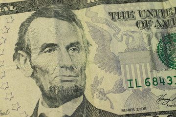 Abraham Lincoln portrait on five dollars banknote macro