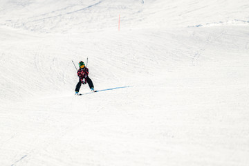 Naklejka na ściany i meble Child skiing in the mountains
