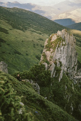 A sign on the side of a mountain