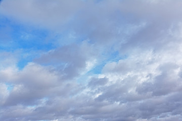 Naklejka na ściany i meble grey cumulonimbus clouds with partly blue sky before the rain.
