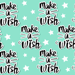 Calligraphic lettering make a wish on a blue background seamless pattern for birthday