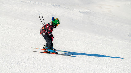 Boy skiing in the mountains