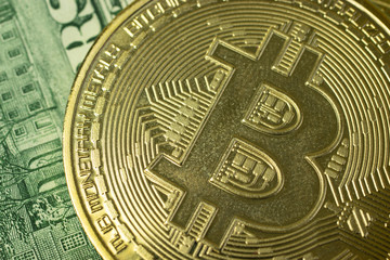 Macro photo of bitcoin logo on background with money