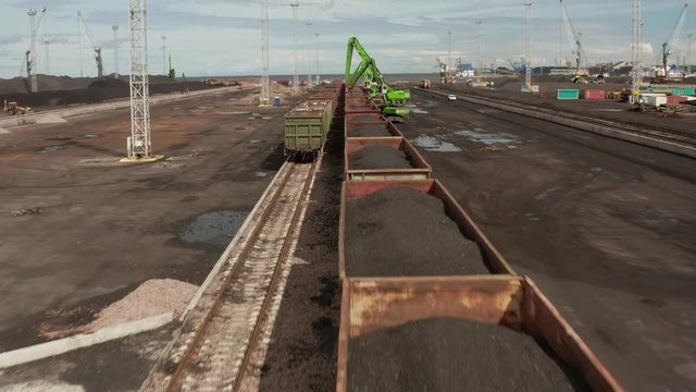 rail freight car unloaded in the sea cargo port, Aerial view, container port terminal and freight station with trains