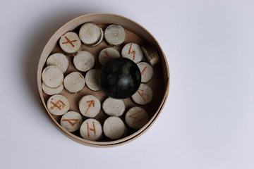 Scandinavic runes in the round box