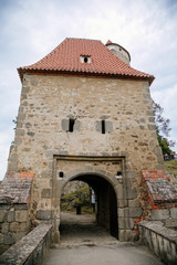 Fototapeta na wymiar Medieval gothic castle Zvikov or Klingenberg on a rock above the confluence of the Vltava and Otava rivers, main entry gate, South Bohemia, Czech Republic