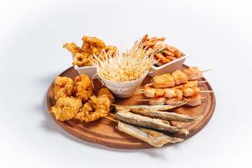 Isolated fried beer platter with fish and shrimps