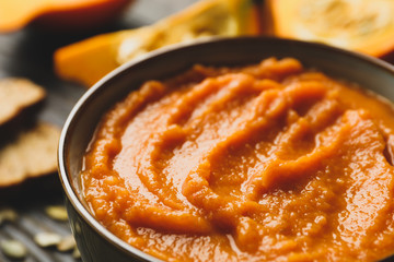 Bowl of fresh pumpkin puree, close up