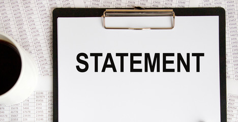 STATEMENTS word made with wood building blocks.