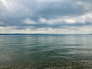 Obraz premium storm clouds over lake in summer