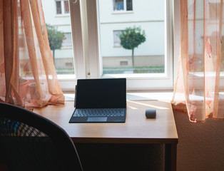 Home office working place with Laptop on a wooden desk. no person. Quarantine at home, corona virus, covid19