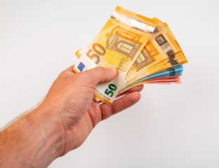 Main tenant des billets de banque en euros