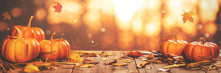 Autumn Banner - Mini Pumpkins On Wooden Table With Orange Falling Leaves Nature Background 