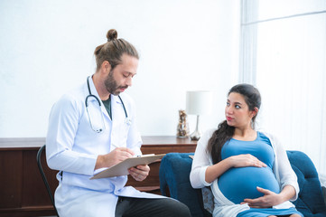 Pregnant women near birth have a pregnancy examination from a specialist doctor at home.
