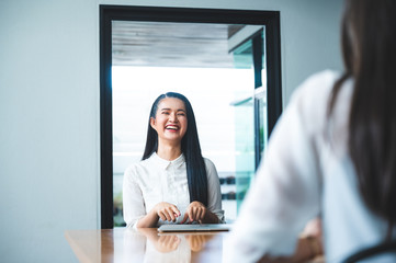two people talking on table and keep distance, social distancing concept