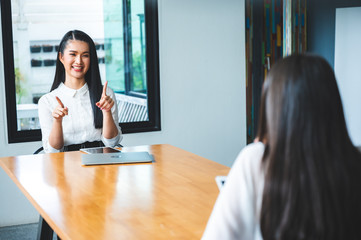 two people talking on table and keep distance, social distancing concept