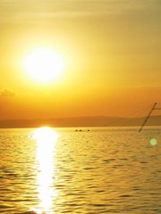A sunset over a body of water
