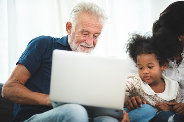 Portrait of happy smiling senior father at home, senior man in family concept